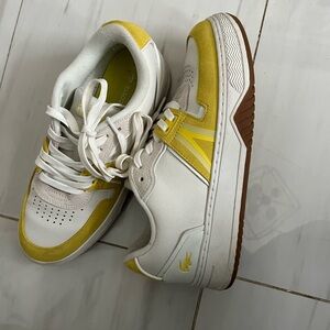 White and yellow Lacoste size 8 shoes
